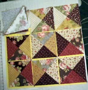 8 Completed Blocks for Ace of Cakes quilt with stack of others to complete